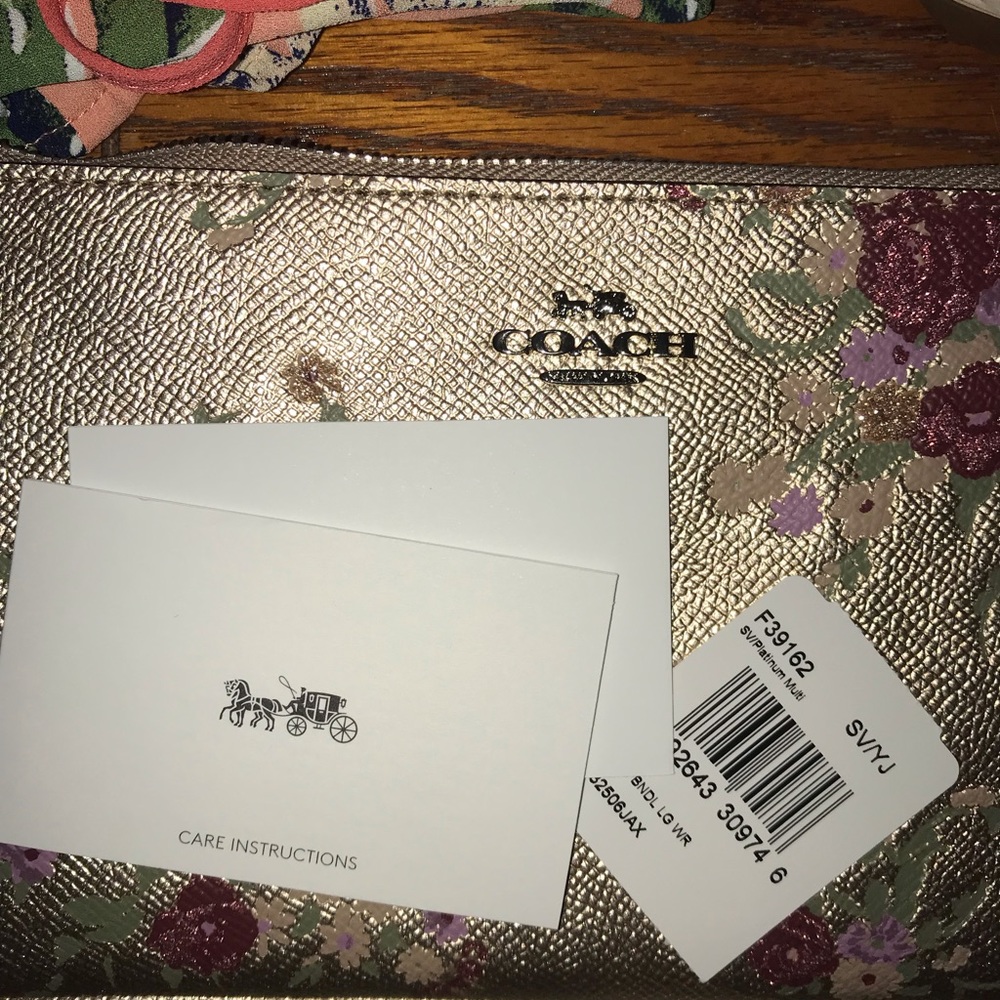 Gold floral Coach wristlet